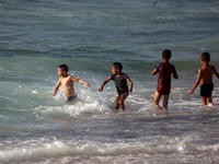 Palestinians are gathering on the beach in Nuseirat in the central Gaza Strip on June 27, 2024, amid ongoing cross-border tensions as fighti...