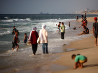 Palestinians are gathering on the beach in Nuseirat in the central Gaza Strip on June 27, 2024, amid ongoing cross-border tensions as fighti...