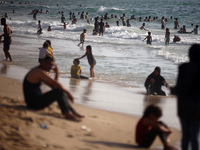 Palestinians are gathering on the beach in Nuseirat in the central Gaza Strip on June 27, 2024, amid ongoing cross-border tensions as fighti...