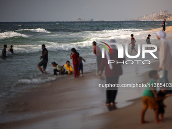 A ship is being pictured off the coast of Gaza near a temporary floating pier anchored by the United States to boost aid deliveries, as seen...