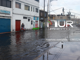 A flooded street is being seen in the municipality of Nezahualcoyotl due to the heavy rains recorded yesterday in Mexico City, Mexico, on Ju...