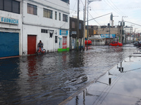 A flooded street is being seen in the municipality of Nezahualcoyotl due to the heavy rains recorded yesterday in Mexico City, Mexico, on Ju...