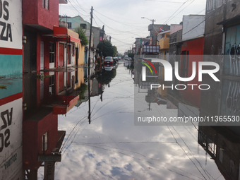 A flooded street is being seen in the municipality of Nezahualcoyotl due to the heavy rains recorded yesterday in Mexico City, Mexico, on Ju...