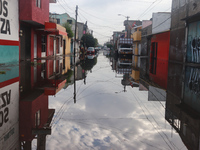 A flooded street is being seen in the municipality of Nezahualcoyotl due to the heavy rains recorded yesterday in Mexico City, Mexico, on Ju...