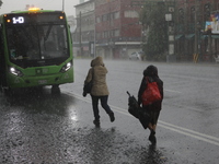 People are running under heavy rains on the Calzada Ermita south of the city, due to Tropical Wave Number 5, which is hitting Mexico. Due to...