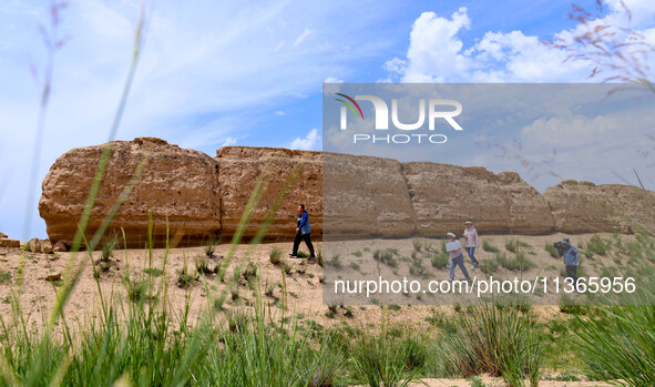 Staff members are conducting site investigation and data collection at the JinshanZi section of the Ming Great Wall in Zhangye, China, on Ju...