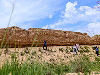 Staff members are conducting site investigation and data collection at the JinshanZi section of the Ming Great Wall in Zhangye, China, on Ju...