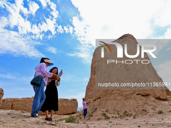 Staff members are conducting on-site investigation and data collection at a beacon tower in the Xitun section of Han Great Wall in Zhangye,...