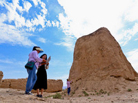 Staff members are conducting on-site investigation and data collection at a beacon tower in the Xitun section of Han Great Wall in Zhangye,...