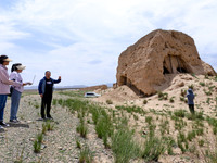 Staff members are conducting site investigation and data collection at the JinshanZi section of the Ming Great Wall in Zhangye, China, on Ju...