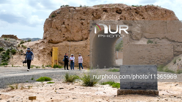 Workers are carrying out site investigation and data collection at the ancient city section of Xiakou in Zhangye, China, on June 27, 2024. I...