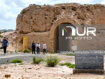 Workers are carrying out site investigation and data collection at the ancient city section of Xiakou in Zhangye, China, on June 27, 2024. I...