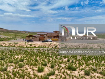 Workers are carrying out site investigation and data collection at Jinshanyi section in Zhangye, China, on June 27, 2024. In recent years, S...