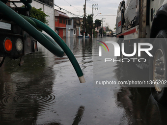 A dewatering truck is draining the water after the heavy rains that hit Mexico. Vicente Villada Avenue in the Municipality of Nezahualcoyotl...