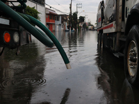 A dewatering truck is draining the water after the heavy rains that hit Mexico. Vicente Villada Avenue in the Municipality of Nezahualcoyotl...