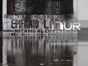 A fence is being seen submerged after the heavy rains that are hitting Mexico. Vicente Villada Avenue in the Municipality of Nezahualcoyotl...