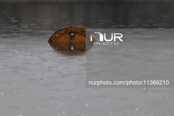 A road sign is being seen submerged due to the heavy rains that are hitting Mexico. Vicente Villada Avenue in the Municipality of Nezahualco...