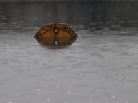 A road sign is being seen submerged due to the heavy rains that are hitting Mexico. Vicente Villada Avenue in the Municipality of Nezahualco...