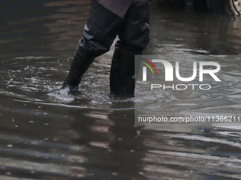 A dewatering worker is draining the water after the heavy rains that hit Mexico. Vicente Villada Avenue in the Municipality of Nezahualcoyot...