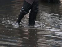 A dewatering worker is draining the water after the heavy rains that hit Mexico. Vicente Villada Avenue in the Municipality of Nezahualcoyot...