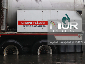 A dewatering truck is draining the water after the heavy rains that hit Mexico. Vicente Villada Avenue in the Municipality of Nezahualcoyotl...