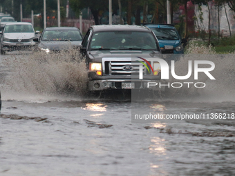 Drivers are trying to cross the Vicente Villada Avenue, which is flooded due to the heavy rains that are hitting Mexico. Vicente Villada Ave...