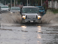 Drivers are trying to cross the Vicente Villada Avenue, which is flooded due to the heavy rains that are hitting Mexico. Vicente Villada Ave...