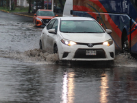 Drivers are trying to cross the Vicente Villada Avenue, which is flooded due to the heavy rains that are hitting Mexico. Vicente Villada Ave...