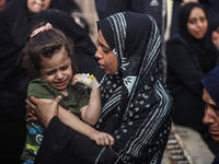 Mourners are reacting during the funeral of Palestinians killed in Israeli strikes, amid the Israel-Hamas conflict, at Al-Aqsa hospital in D...