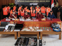 Indonesian immigration authorities are showing a group of detained Taiwan nationals during a press conference at the Immigration Detention H...