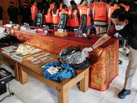 Indonesian immigration authorities are showing evidence during a press conference at the Immigration Detention House in Jimbaran, Bali, Indo...