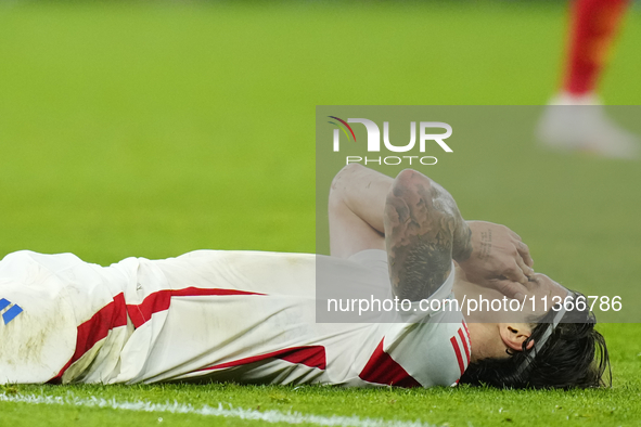 Riccardo Calafiori centre-back of Italy and Bologna FC 1909 lament a failed occasion during the UEFA EURO 2024 group stage match between Spa...