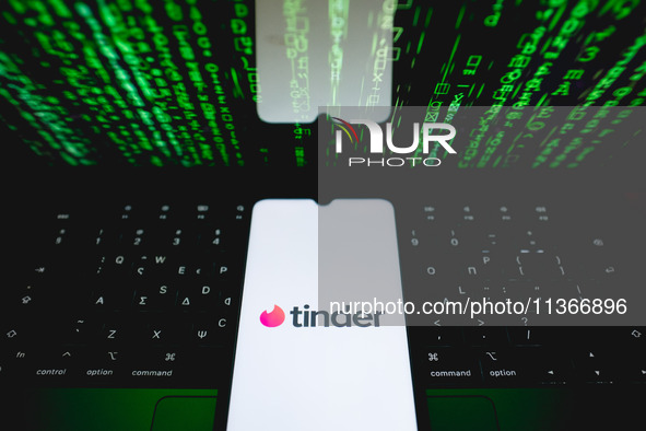 The Tinder logo is being displayed on a smartphone screen in Athens, Greece, on June 28, 2024. (Photo Illustration by Nikolas Kokovlis/NurPh...