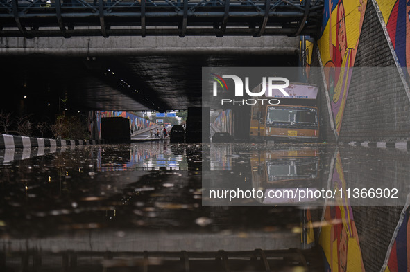 Vehicles are being seen submerged on a flooded road after heavy rains in New Delhi, India, on June 28, 2024. 