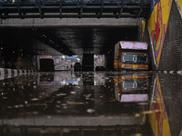 Vehicles are being seen submerged on a flooded road after heavy rains in New Delhi, India, on June 28, 2024. (