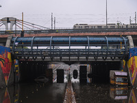 Vehicles are being seen submerged on a flooded road after heavy rains in New Delhi, India, on June 28, 2024. (