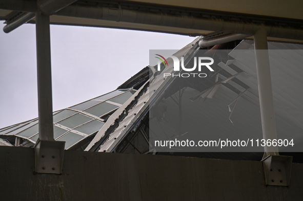 A portion of a damaged canopy is being seen at Terminal 1 of the Indira Gandhi International Airport after heavy rains in New Delhi, India,...