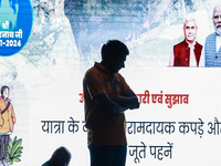 A devotee is standing inside a tent with PM Modi and LG Manoj Sinha's picture flashing on a screen inside Nunwan basecamp in Pahalgam, Jammu...