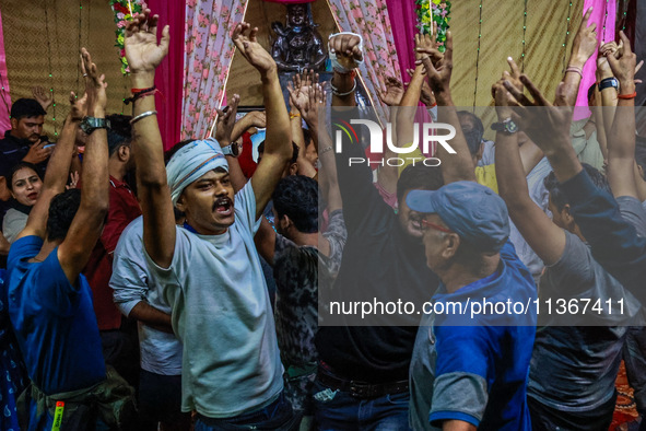 Hindu devotees are dancing inside Nunwan basecamp ahead of their Amarnath Cave visit in Pahalgam, Jammu and Kashmir, India, on June 28, 2024...