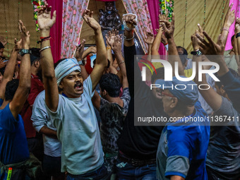 Hindu devotees are dancing inside Nunwan basecamp ahead of their Amarnath Cave visit in Pahalgam, Jammu and Kashmir, India, on June 28, 2024...