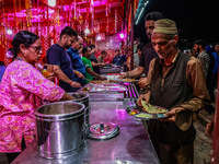 Hindus and Muslims are eating from a free food camp inside Nunwan basecamp ahead of Amarnath Cave Yatra in Pahalgam, Jammu and Kashmir, Indi...