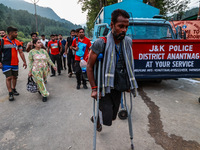 Devotees are walking towards Nunwan Basecamp where the first group of pilgrims is leaving for Amarnath Cave in Pahalgam, Jammu and Kashmir,...