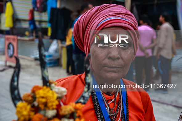 Sita Devi from UP is arriving at Nunwan basecamp from where she will leave for Amarnath Cave the next morning in Pahalgam, Jammu and Kashmir...