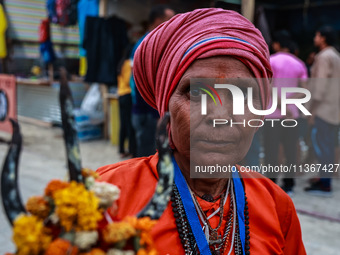 Sita Devi from UP is arriving at Nunwan basecamp from where she will leave for Amarnath Cave the next morning in Pahalgam, Jammu and Kashmir...