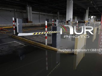 I am viewing the outside of a flooded shopping mall in Ecatepec, State of Mexico, due to the rains during the last few days. (