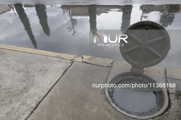 A sieve is sitting outside a flooded shopping plaza in Ecatepec, State of Mexico, as a result of the rains during the last few days. 