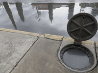 A sieve is sitting outside a flooded shopping plaza in Ecatepec, State of Mexico, as a result of the rains during the last few days. (