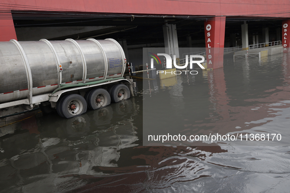 I am viewing the outside of a flooded shopping mall in Ecatepec, State of Mexico, due to the rains during the last few days. 