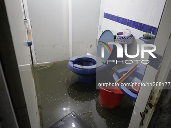 I am viewing an affected bathroom after flooding in Ecatepec, State of Mexico, due to the rains during the last few days. (