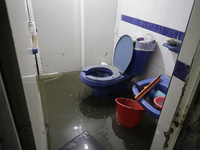 I am viewing an affected bathroom after flooding in Ecatepec, State of Mexico, due to the rains during the last few days. (